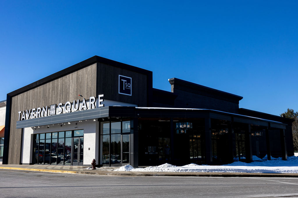 Modern restaurant building with large windows and bold 