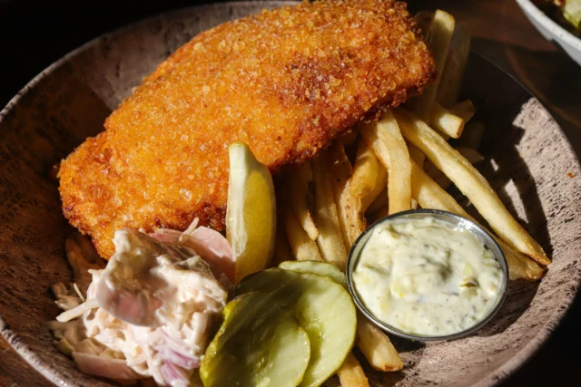 A Fry-Day Favorite!🍸🌊

Crispy, golden, and downright delicious-our Fish & Chips is the perfect way to kick off the weekend. Light, flaky haddock with a chip crust, house fries, slaw, and tartar... it’s a classic for a reason! No red meat Fridays? No Problem! ✨

Stop by and reel in this fan favorite today! 🍽️